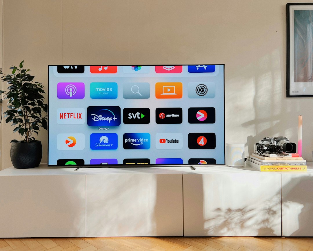 Modern television in a living room for checking IPTV programme guide settings