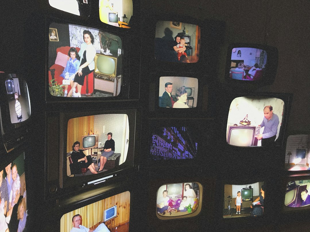 Multiple television screens showing a home entertainment setup