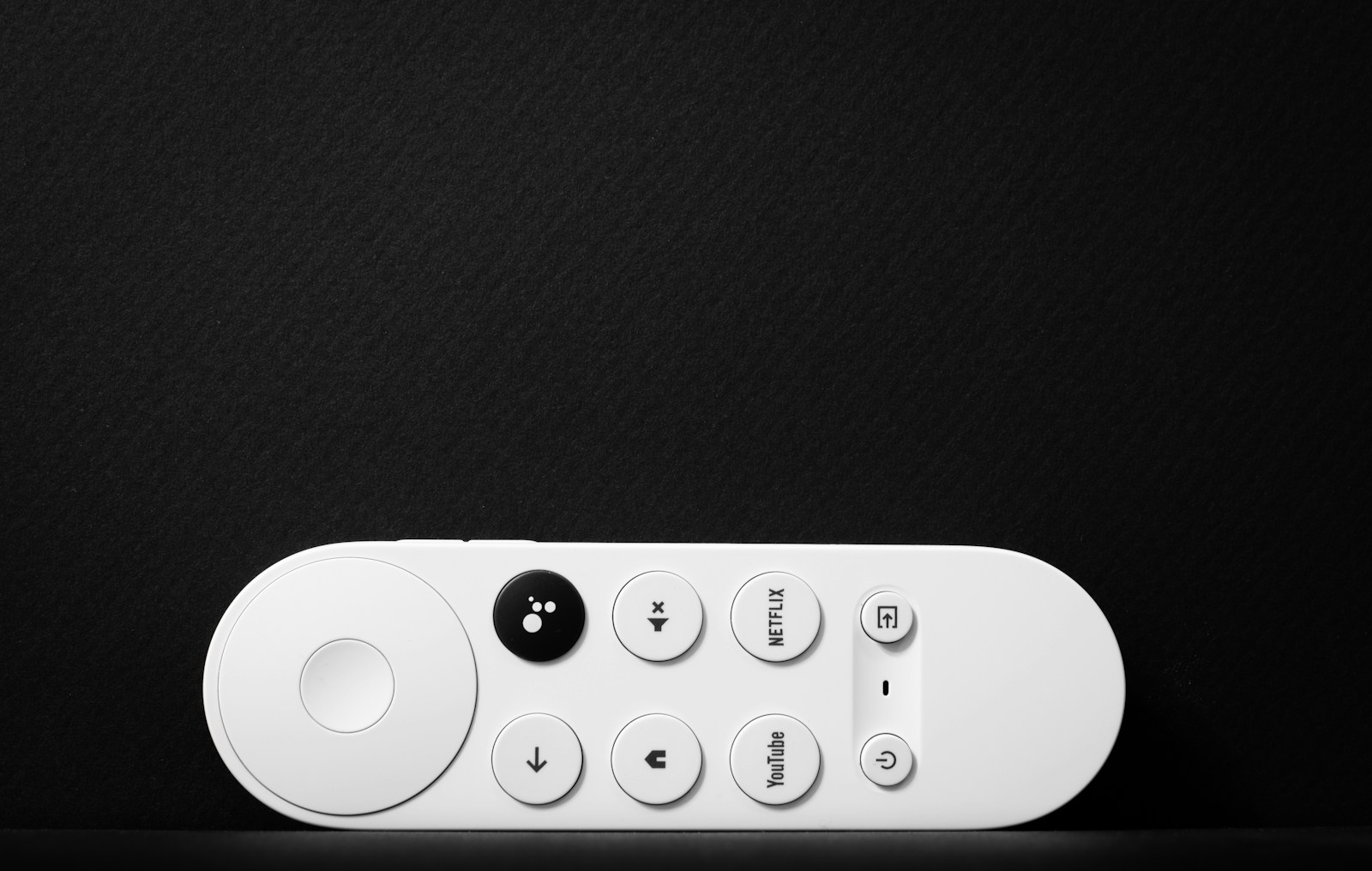 Remote control used with a Google TV streaming setup